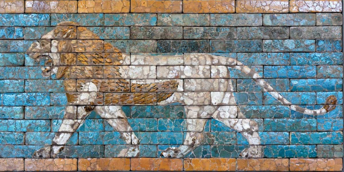Ancient glazed brick relief showing a roaring lion walking to the left on a blue and tan background.