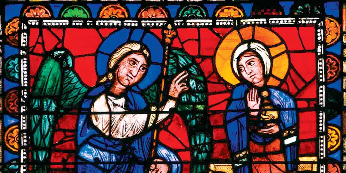 Stained glass window showing an angel with a staff and a woman with a halo holding a jar.