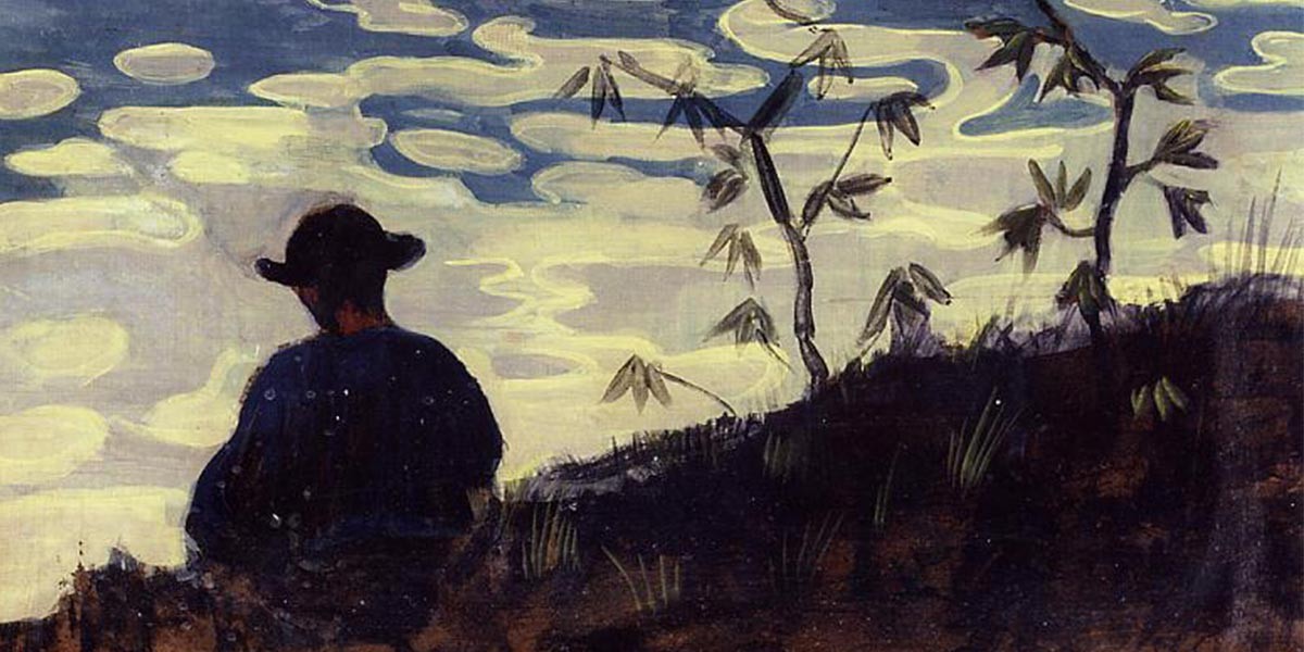 Silhouette of a person in a hat sitting on a dark hill with sparse plants under a cloudy sky.
