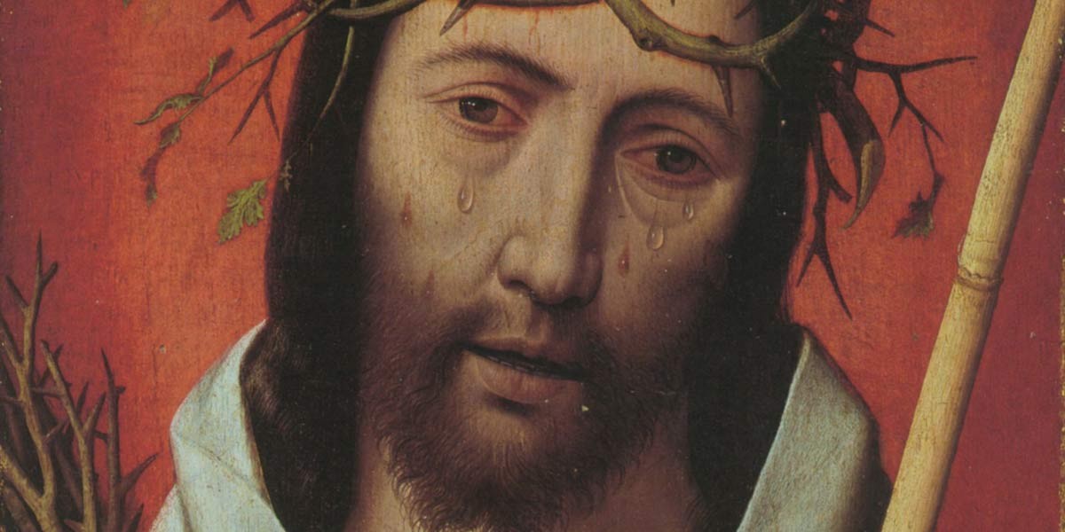 Close-up of Jesus wearing a crown of thorns with tears on his face and holding a staff against a red background.