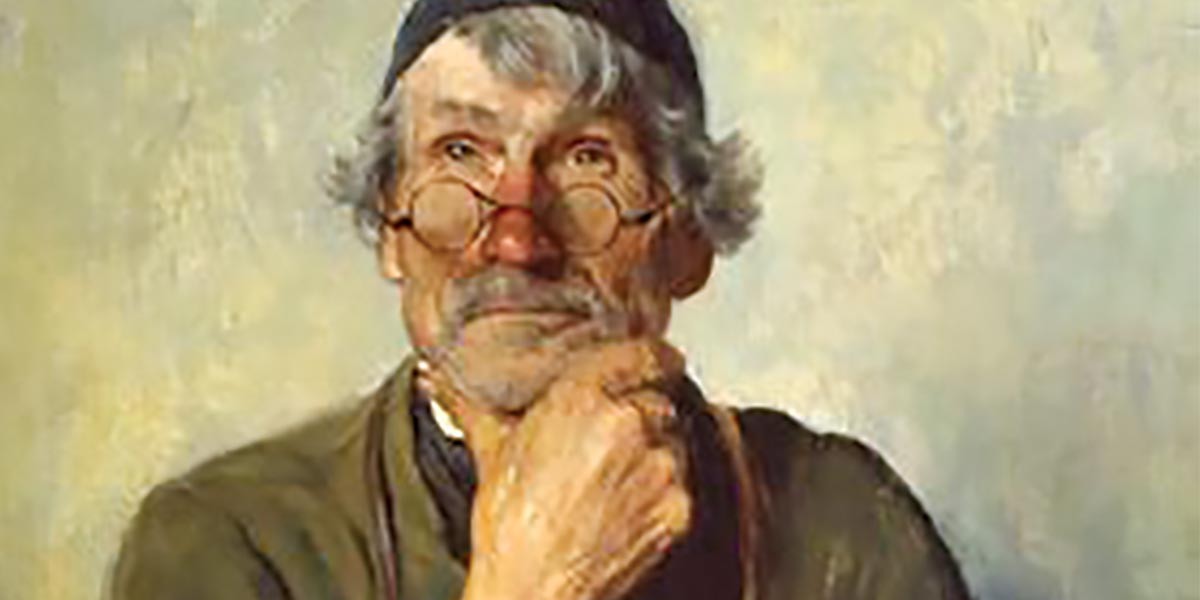 Portrait of an elderly man with gray hair, round glasses, and hand resting on his chin.