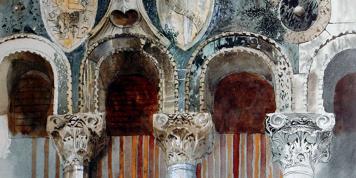 Ornate marble columns with carved capitals beneath arches decorated with shields and patterns.