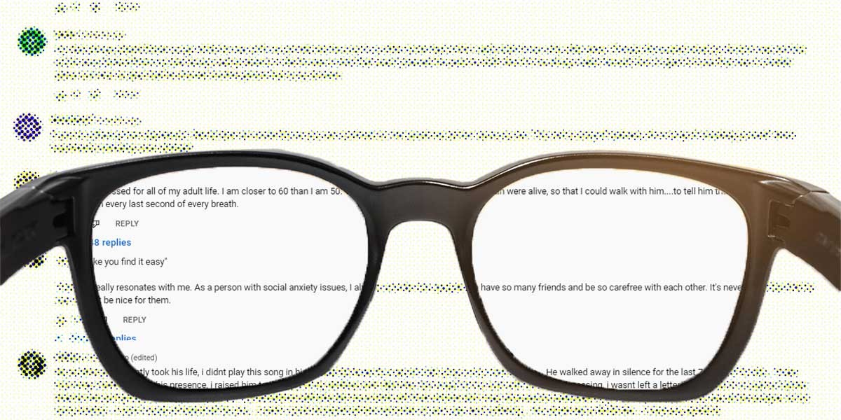 Black eyeglasses focusing on clear text with blurred, colored text in background.