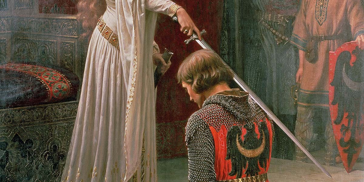 A woman in white robes knights a kneeling man in chainmail with a sword on his shoulder.