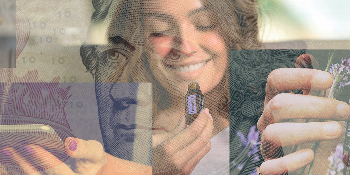 Smiling woman holding a small bottle labeled lavender with a superimposed close-up of a U.S. currency face.