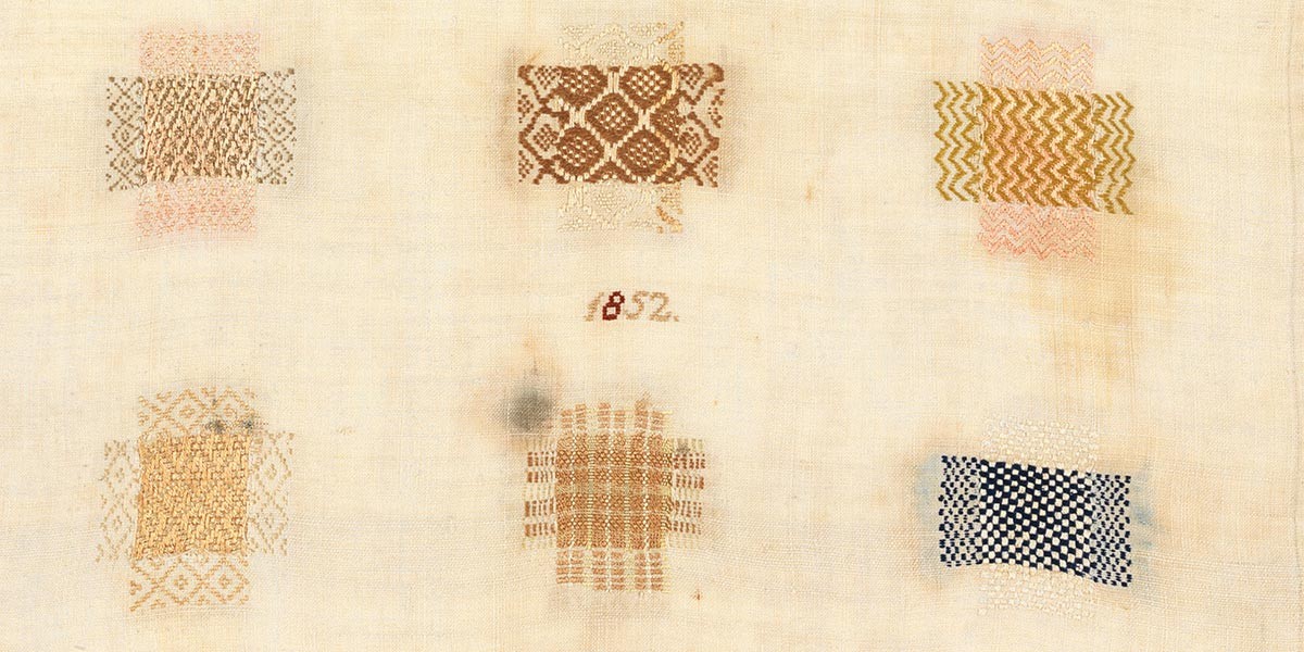 Six different colored fabric patches with intricate woven patterns on a light cloth background.