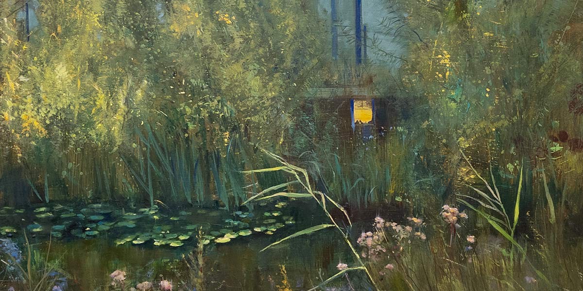 A serene pond with lily pads surrounded by dense tall grasses and wildflowers at dusk.