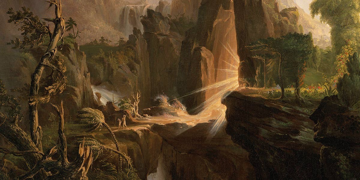 Sunlight beams shining through a rocky cliff opening onto a lush, forested landscape with figure silhouettes.