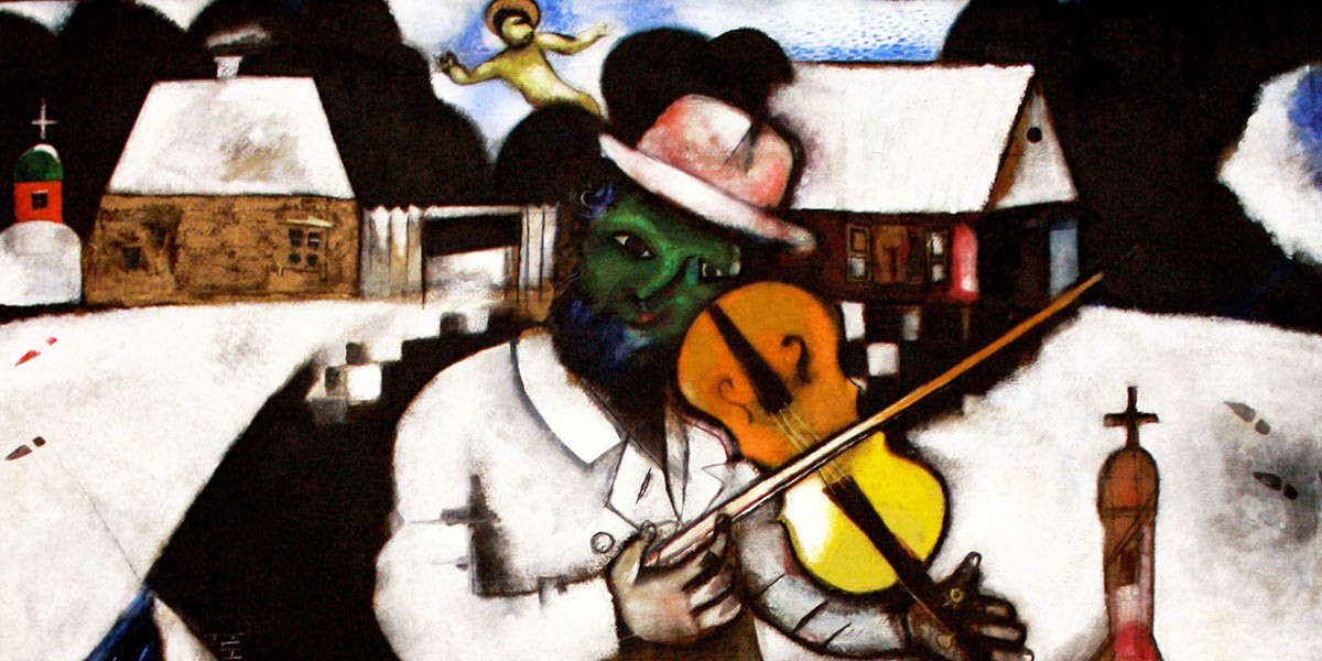 Abstract painting of a man with a green face playing violin in a snowy village with houses and trees.
