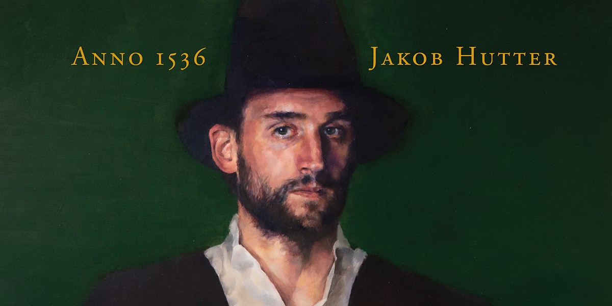 Portrait of a bearded man wearing a black hat and dark coat against a green background with text Anno 1536.