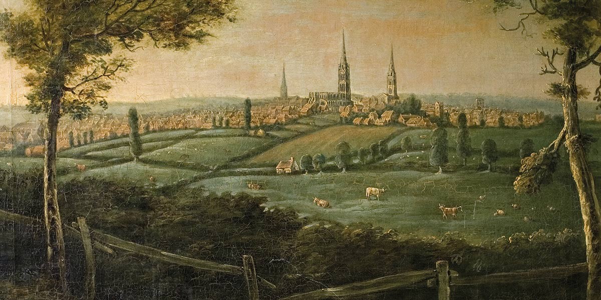 Historic cityscape painting with green fields, grazing cows, trees, and cathedral spires in the distance.