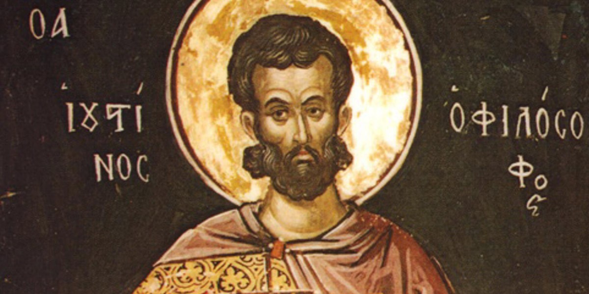 Icon of a bearded saint with a golden halo and patterned robe against a dark background.