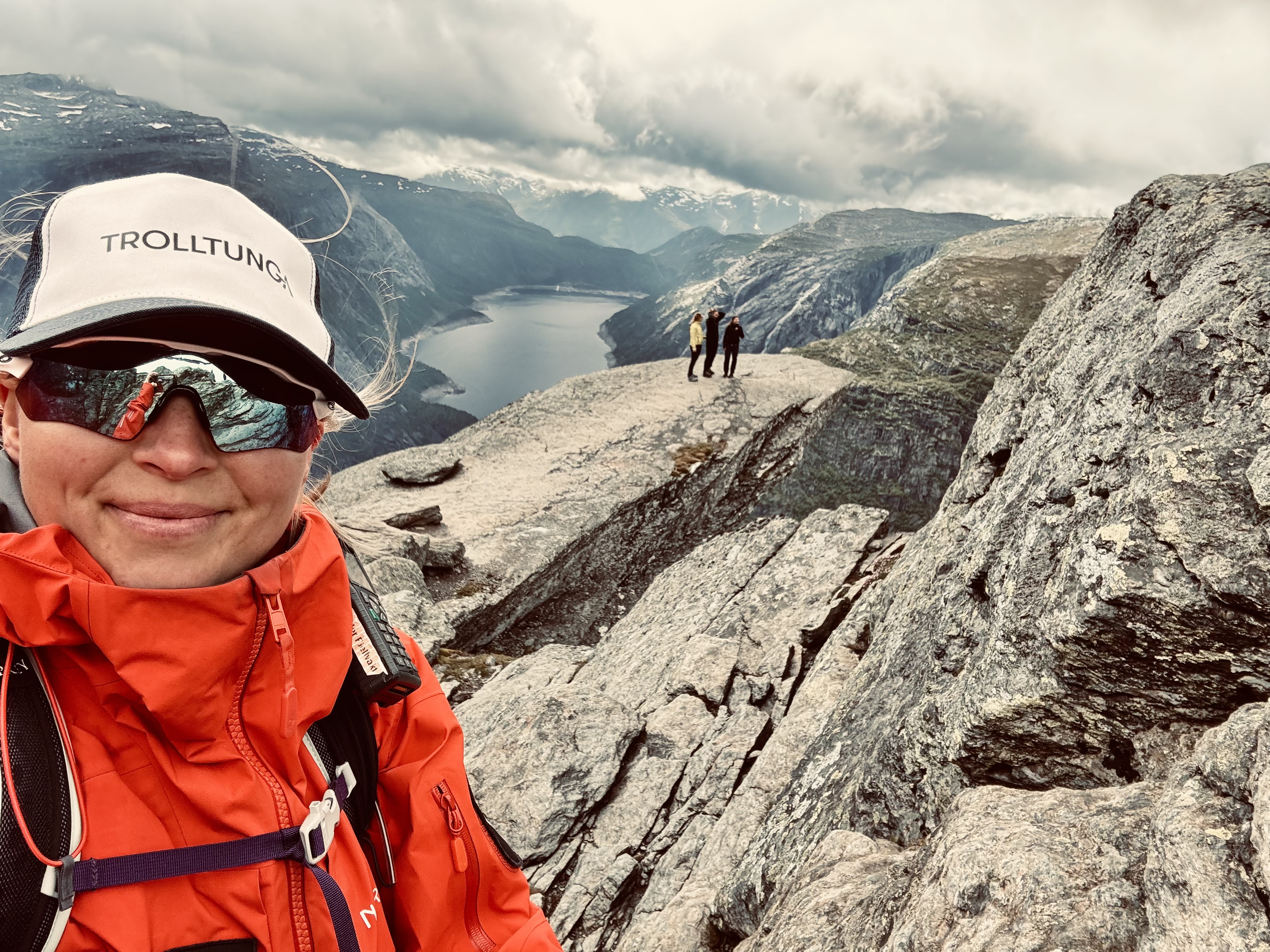Mountain Ranger Karianne at Trolltunga overlooking Ringedalsvatnet lake