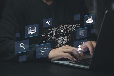 A person works on a laptop, surrounded by icons representing AI concepts - a brain with a gear, data analysis, tools, search, chat, user profiles, and connectivity.