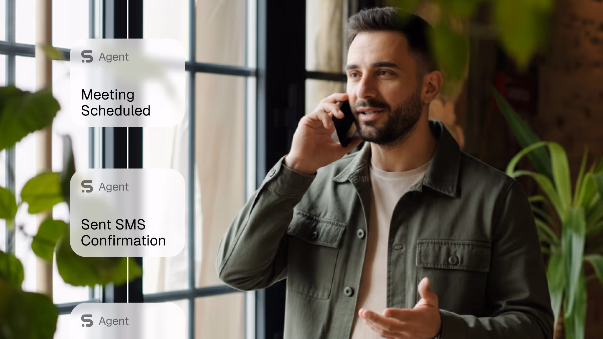Man talking on a smartphone near a window with chat bubbles displaying 'Meeting Scheduled' and 'Sent SMS Confirmation'.