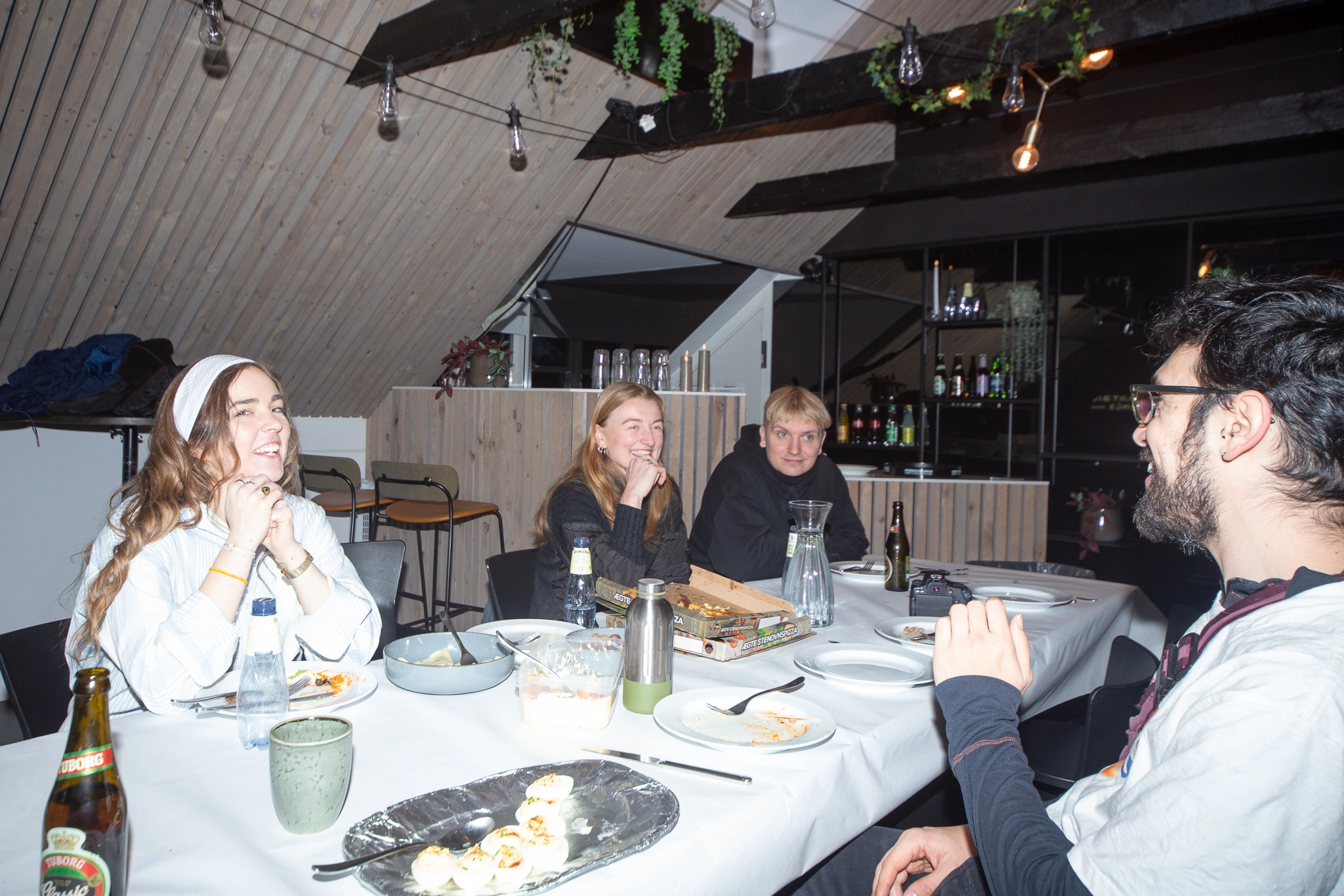 A team of young people gathered around a table