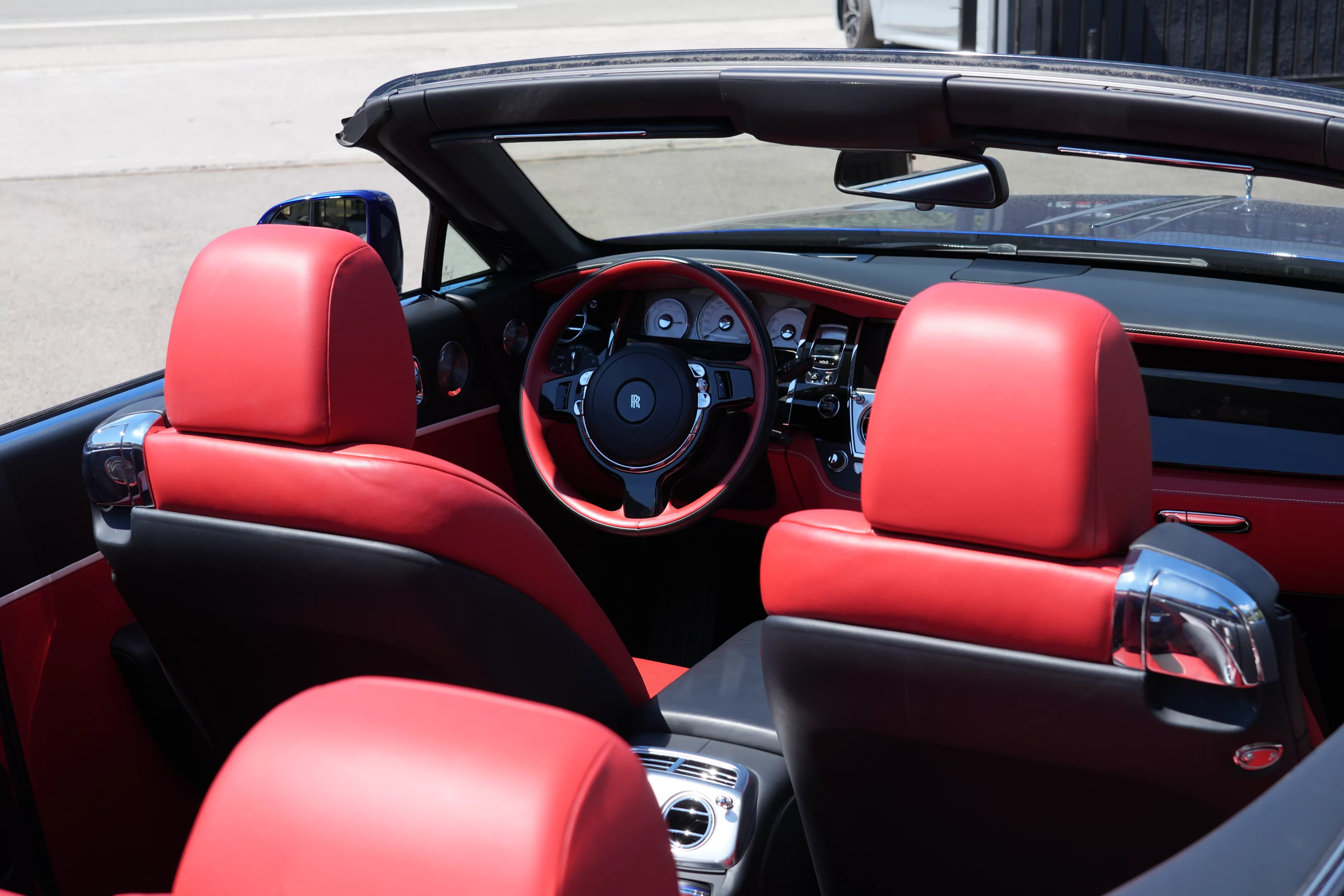 Experience the Rolls-Royce Dawn, the ultimate luxury convertible that blends effortless power with timeless elegance. Beneath its sculpted hood lies a 6.6-liter twin-turbocharged V12 engine, delivering 563 horsepower for a whisper-quiet yet exhilarating driving experience. With a seamless soft-top roof that retracts in complete silence, the Dawn transforms any journey into an open-air masterpiece. Inside, indulge in handcrafted luxury, featuring the finest leathers, bespoke wood veneers, and the signature Starlight Headliner. Advanced technology, including a premium Bespoke Audio system and intuitive digital displays, ensures supreme comfort and connectivity. Whether cruising through the city or along the coast, the Rolls-Royce Dawn offers an unparalleled blend of sophistication and freedom. Discover the art of open-top luxury today.