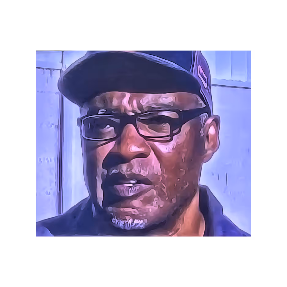 Person wearing glasses and cap in blue-tinted portrait with stylized effect