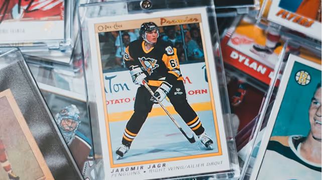 Jaromir Jagr Pittsburgh Penguins hockey card showing him in black and yellow uniform on the ice.