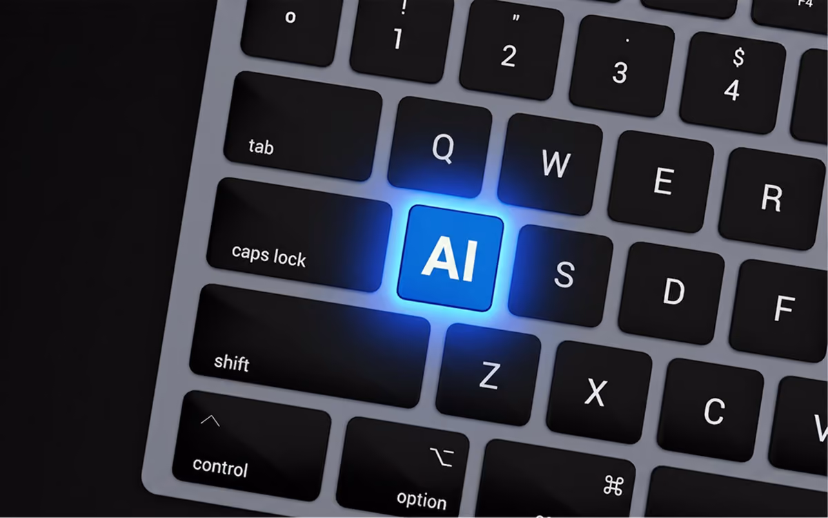 A macbook keypad with an AI button glowing