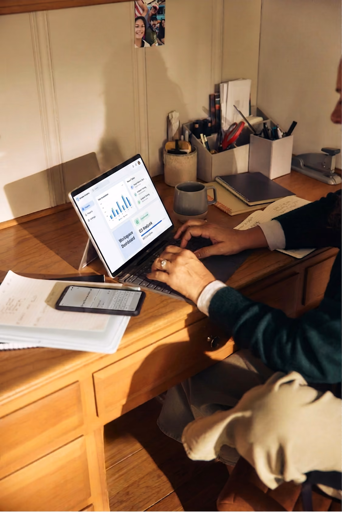 A man using laptop with a dashboard interface