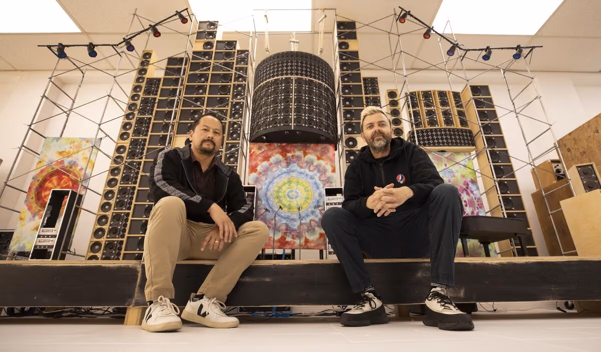 Founders of Analogr sitting in front of a live stage