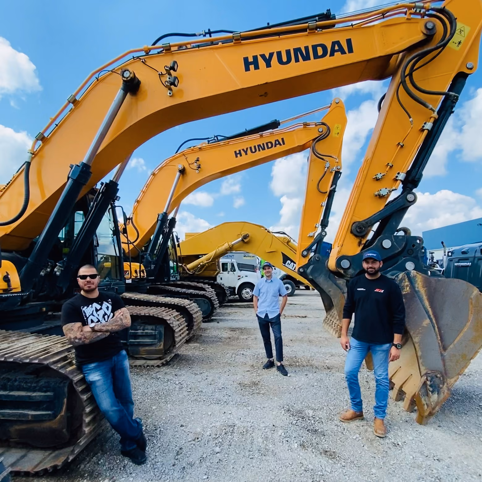 Eqpme Founder Team standing next to construction machines