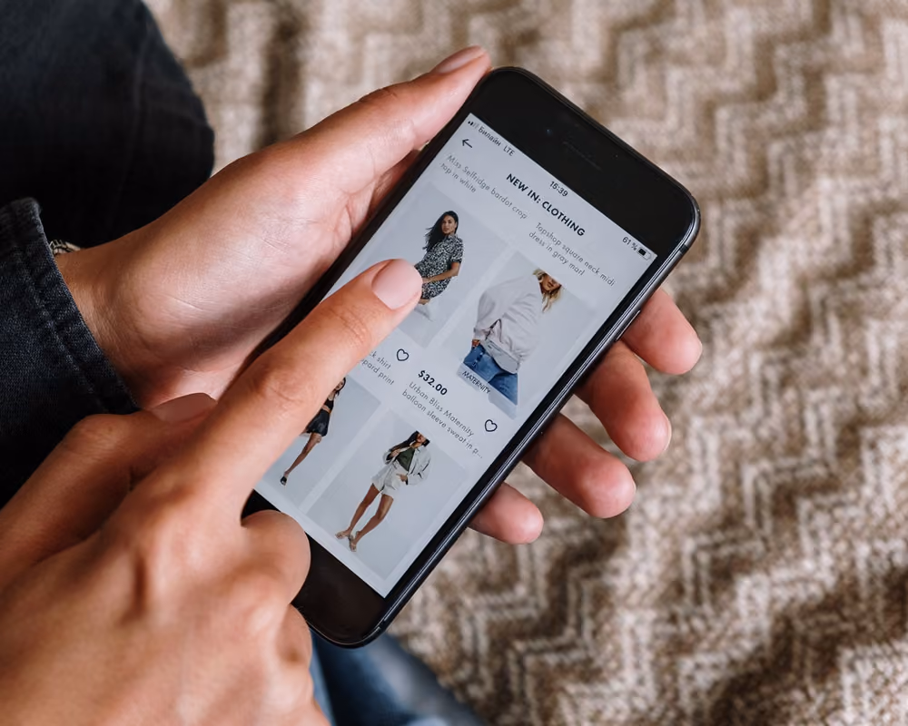 A person using mobile to online shop