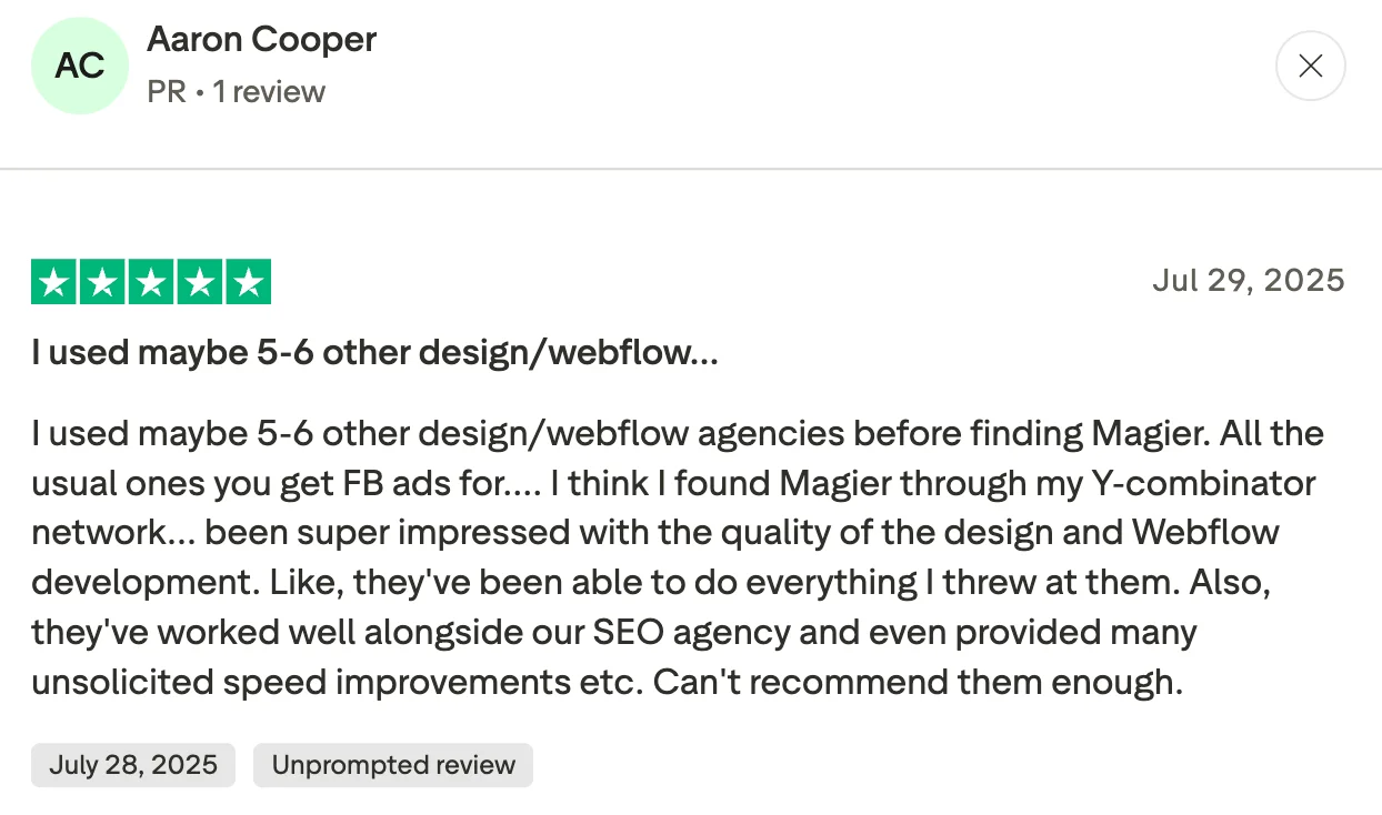 Trustpilot review from Aaron Cooper praising magier's Webflow design and development quality after trying 5-6 other agencies