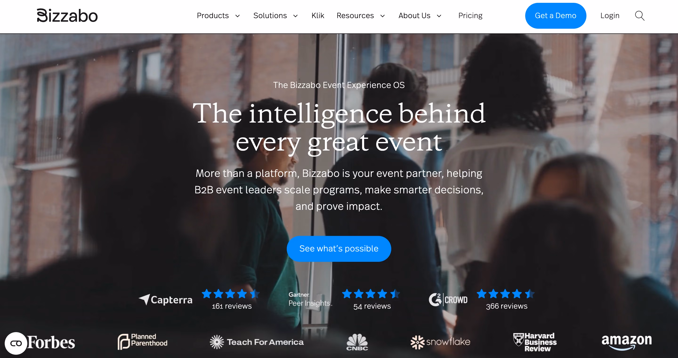 Bizzabo Event Experience OS homepage featuring "The intelligence behind every great event" headline with Capterra, Gartner, and G2 review badges and client logos like Forbes and Amazon