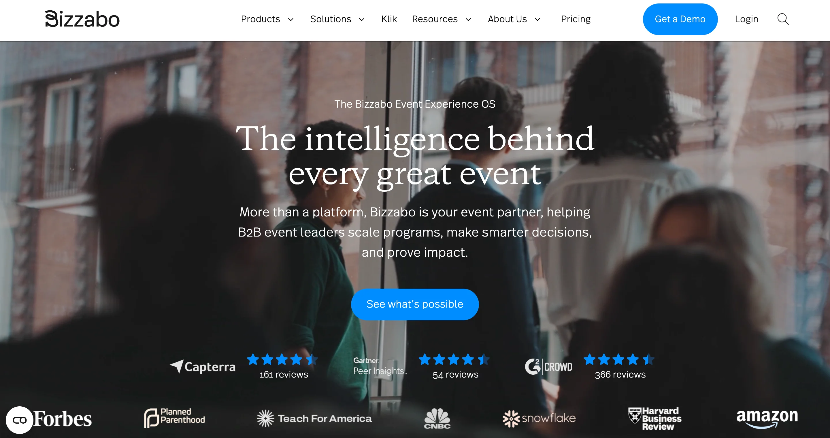 Bizzabo Event Experience OS homepage featuring "The intelligence behind every great event" headline with Capterra, Gartner, and G2 review badges and client logos like Forbes and Amazon