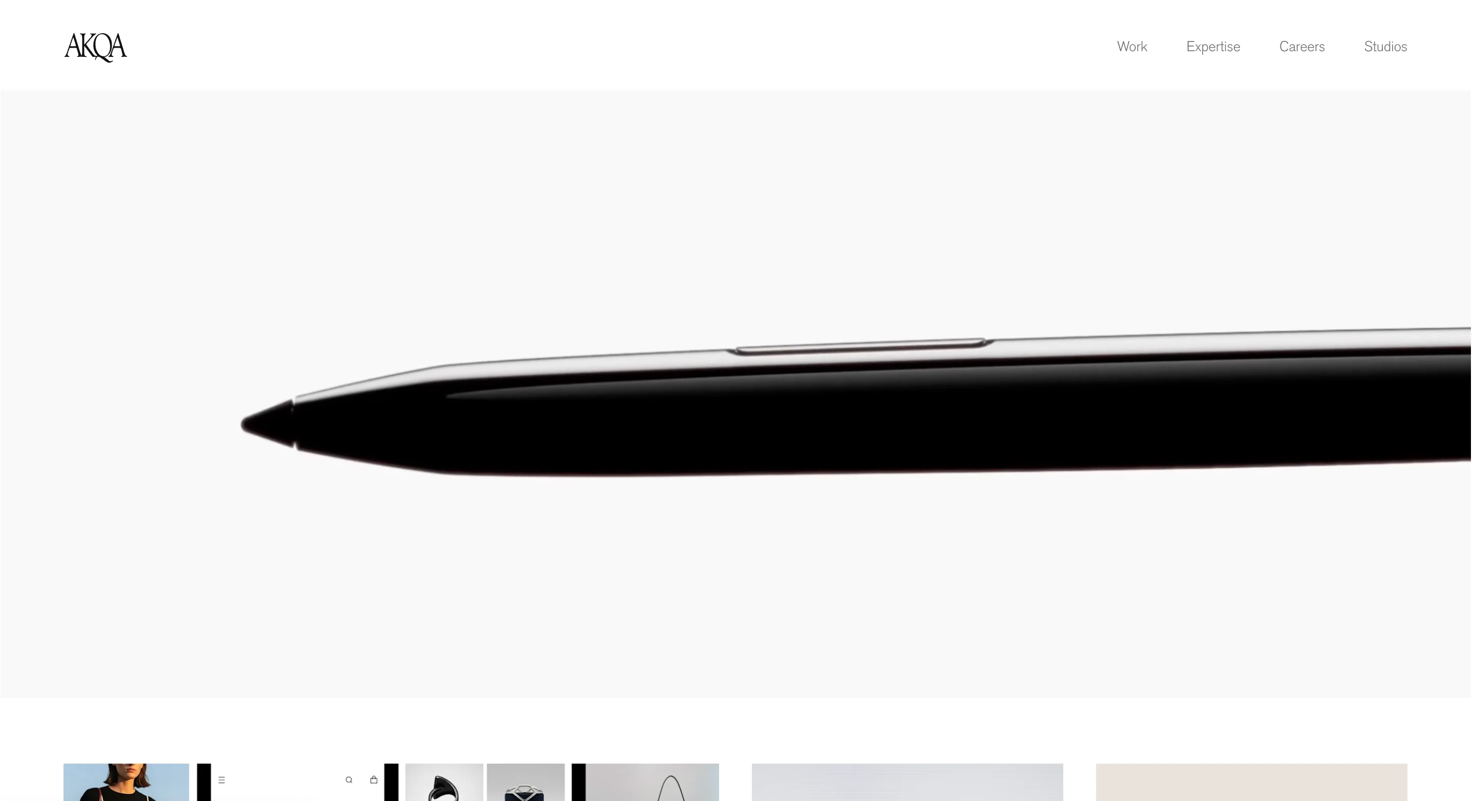 Homepage of AKQA, one of the best creative agencies for digital-first experiences, displaying a minimal product-focused hero image that reflects their design-led approach to innovation