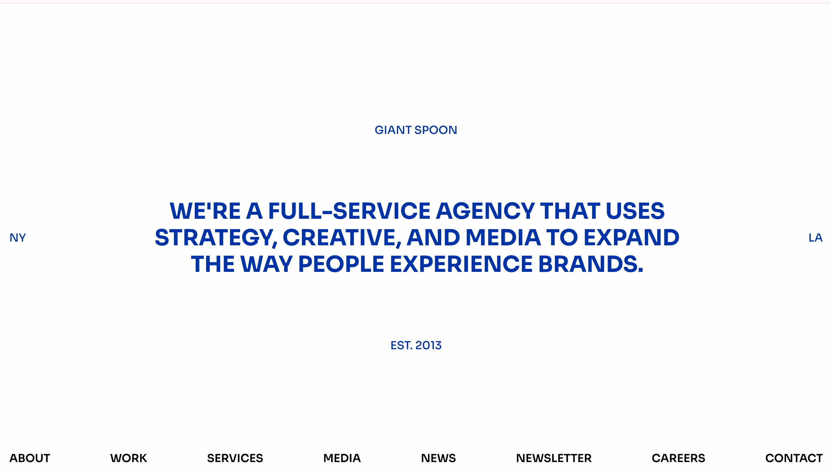 Homepage of Giant Spoon, one of the best creative agencies for experiential marketing, displaying a clean white layout with the headline "We're a full-service agency that uses strategy, creative, and media to expand the way people experience brands"