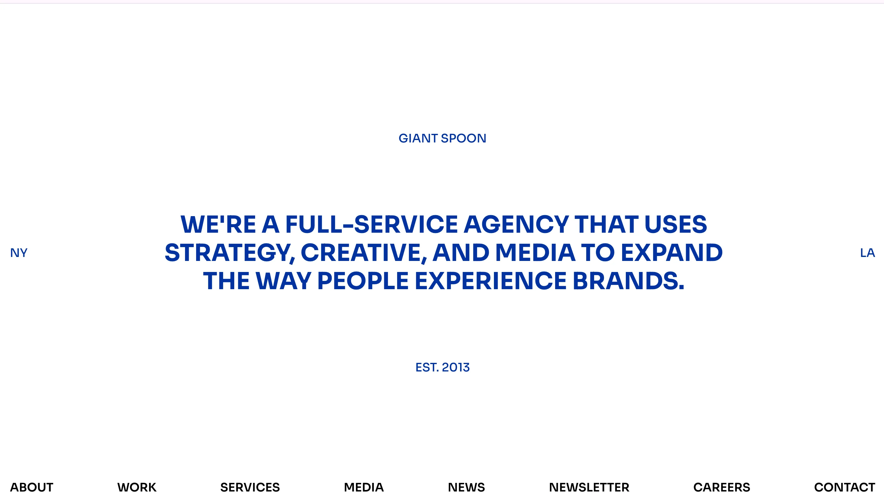 Homepage of Giant Spoon, one of the best creative agencies for experiential marketing, displaying a clean white layout with the headline "We're a full-service agency that uses strategy, creative, and media to expand the way people experience brands"