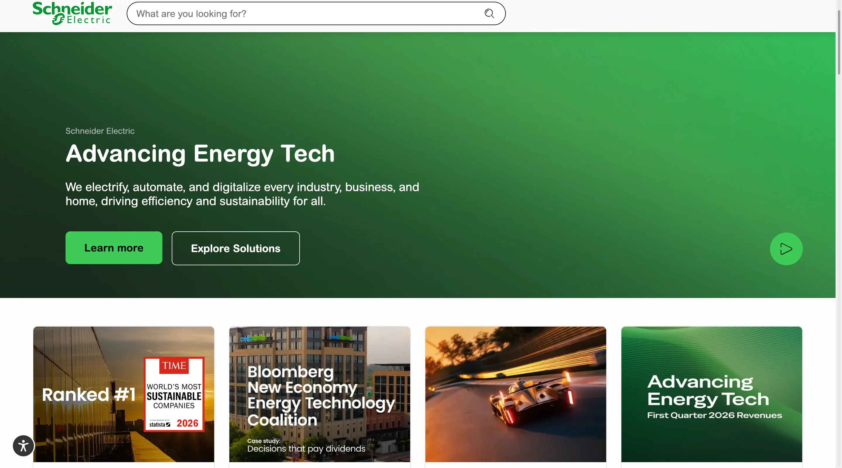 Schneider Electric homepage hero on a green gradient background, headline "Advancing Energy Tech," subtext about electrifying, automating, and digitalizing industry, with Learn more and Explore Solutions buttons, and a row of news cards below including a Time sustainability ranking and a Bloomberg case study.