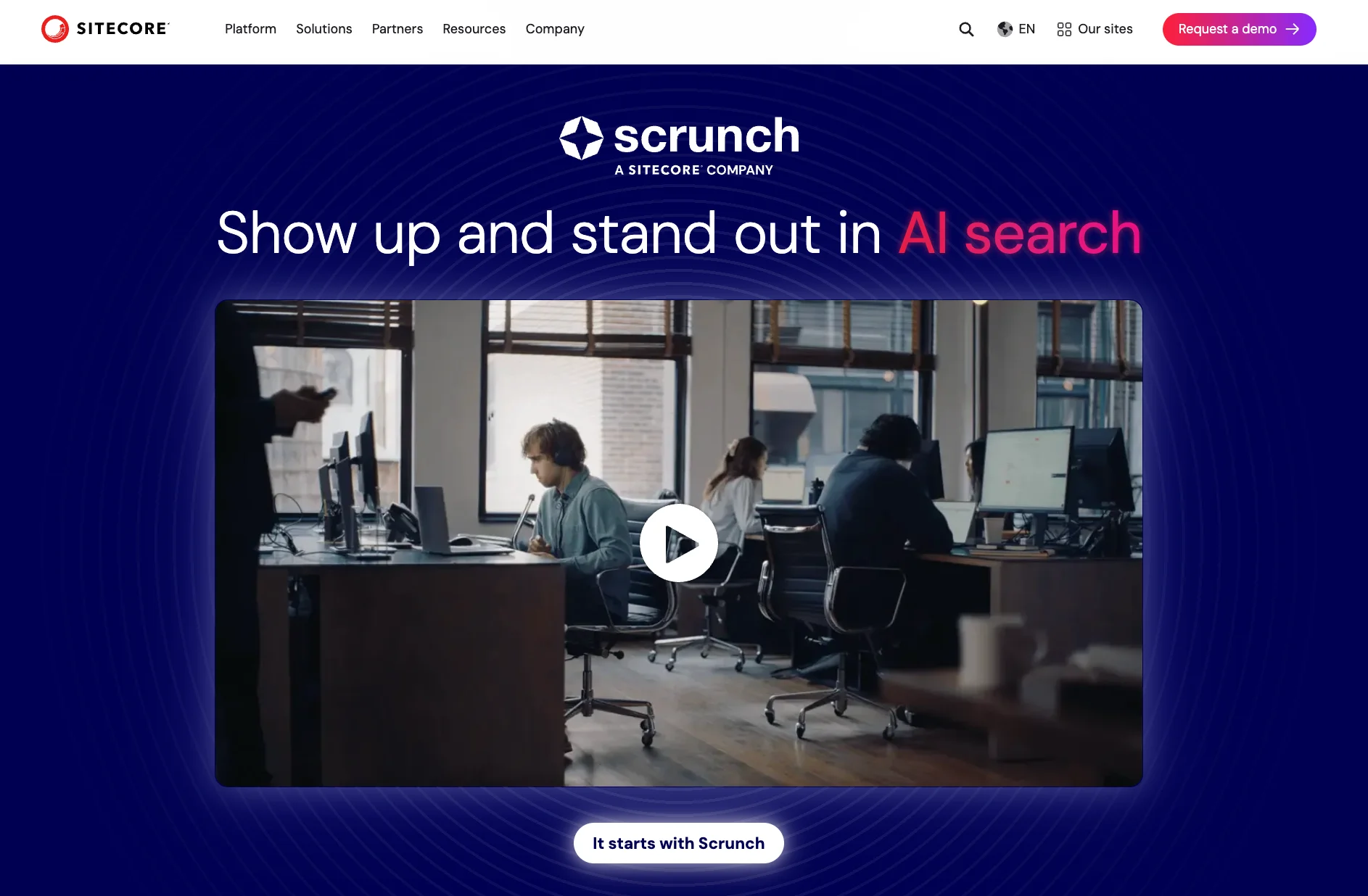 Sitecore's Scrunch product page with the headline "show up and stand out in AI search." Below sits a video thumbnail of an office scene with people working at desks, and a "it starts with Scrunch" button beneath the video.