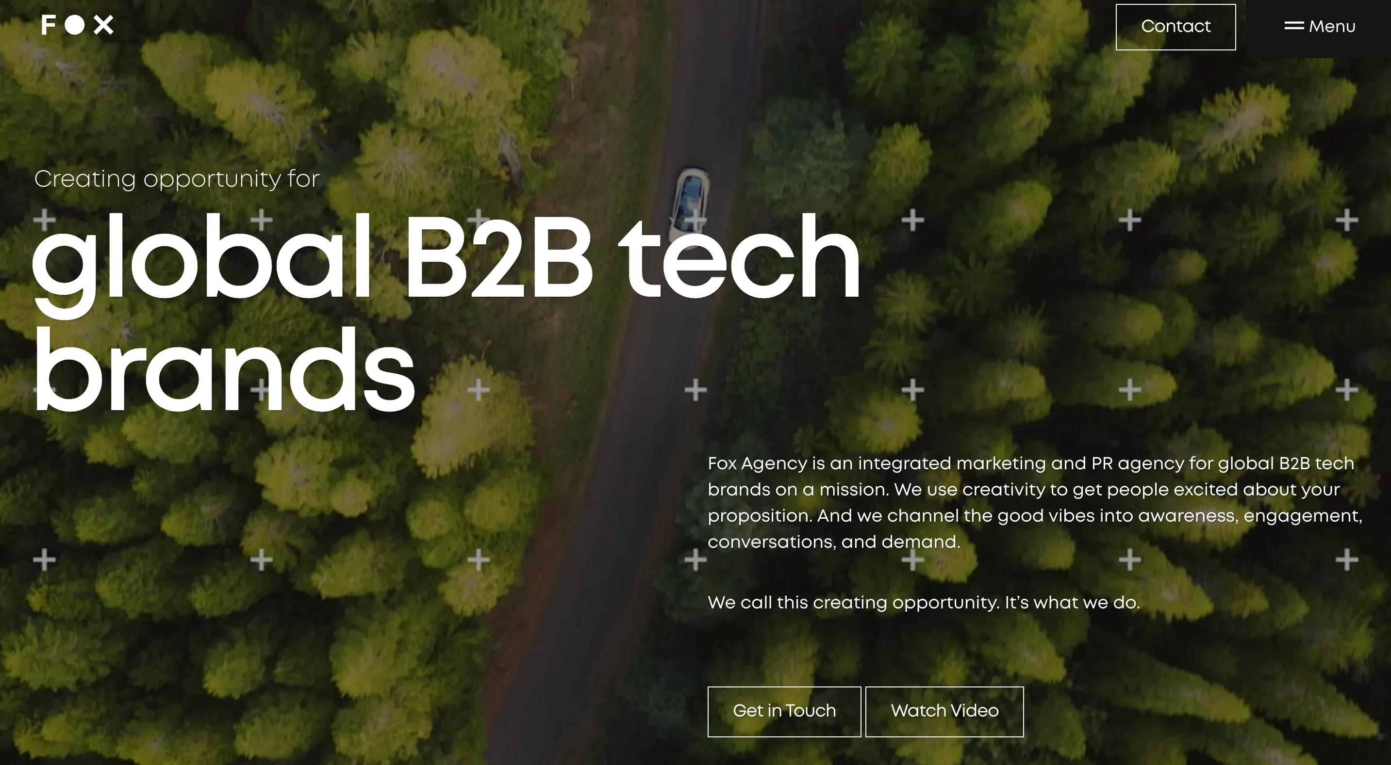 Fox Agency SaaS marketing agency homepage showing an aerial forest road with the headline "Creating opportunity for global B2B tech brands" and Get in Touch and Watch Video buttons