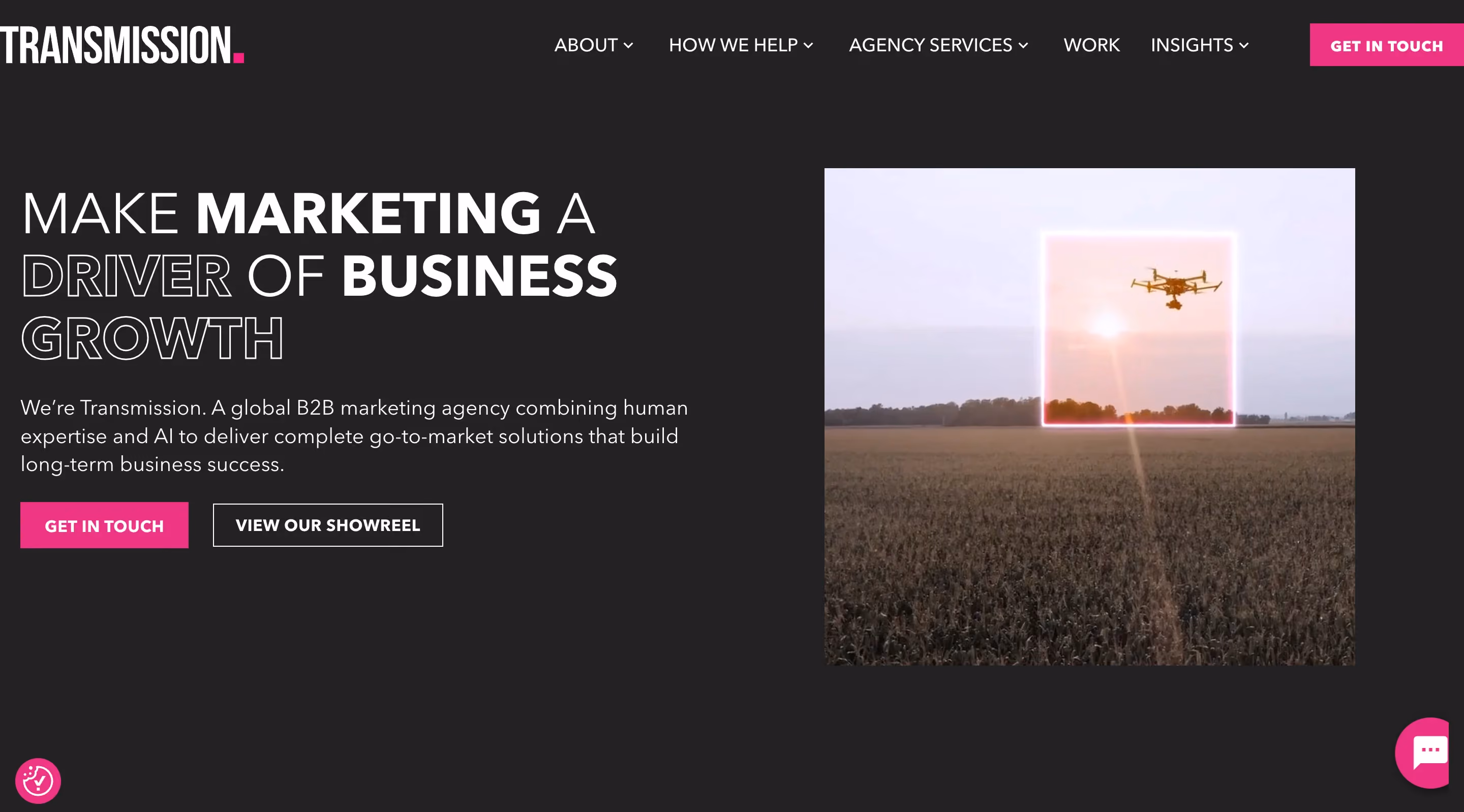 Transmission global B2B marketing agency homepage displaying the headline "make marketing a driver of business growth" on a dark background with a drone campaign visual