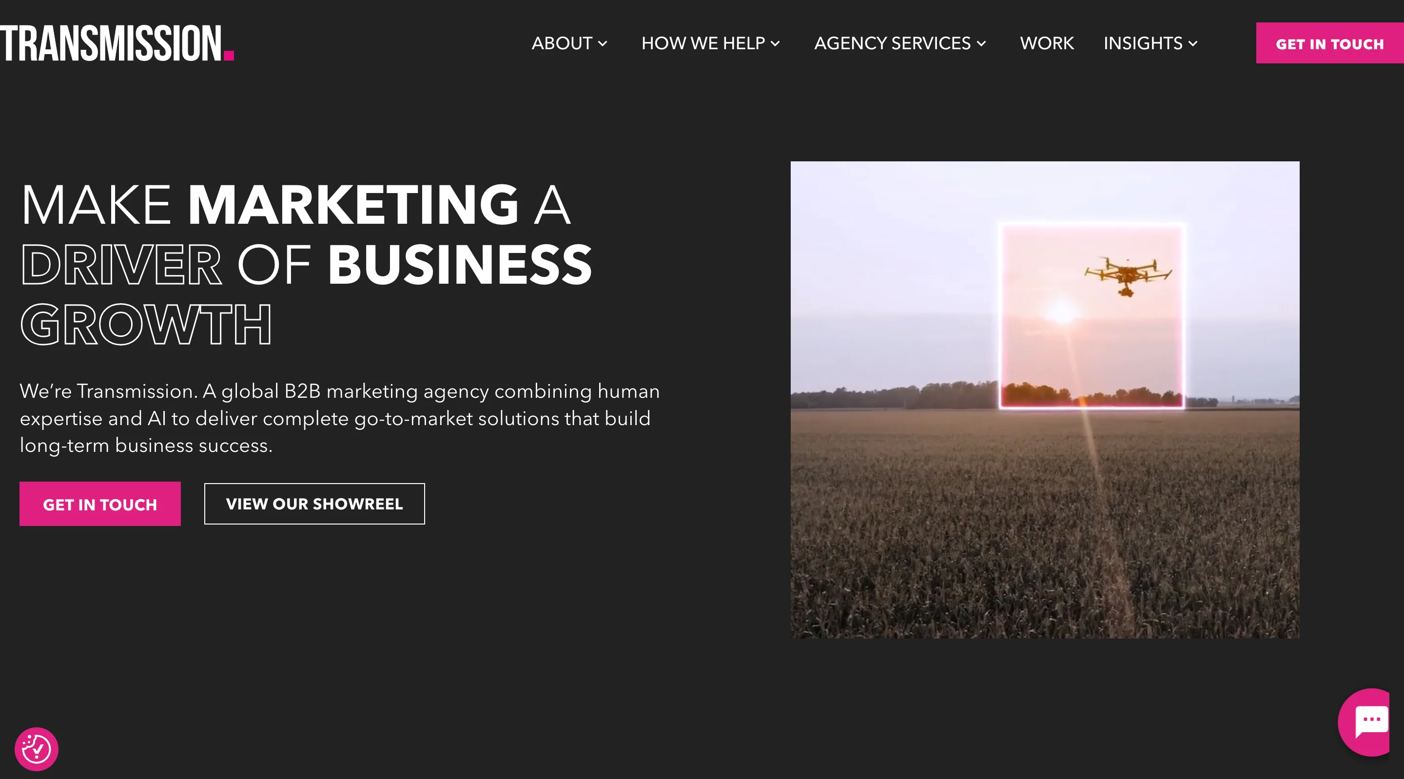 Transmission global B2B marketing agency homepage displaying the headline "make marketing a driver of business growth" on a dark background with a drone campaign visual
