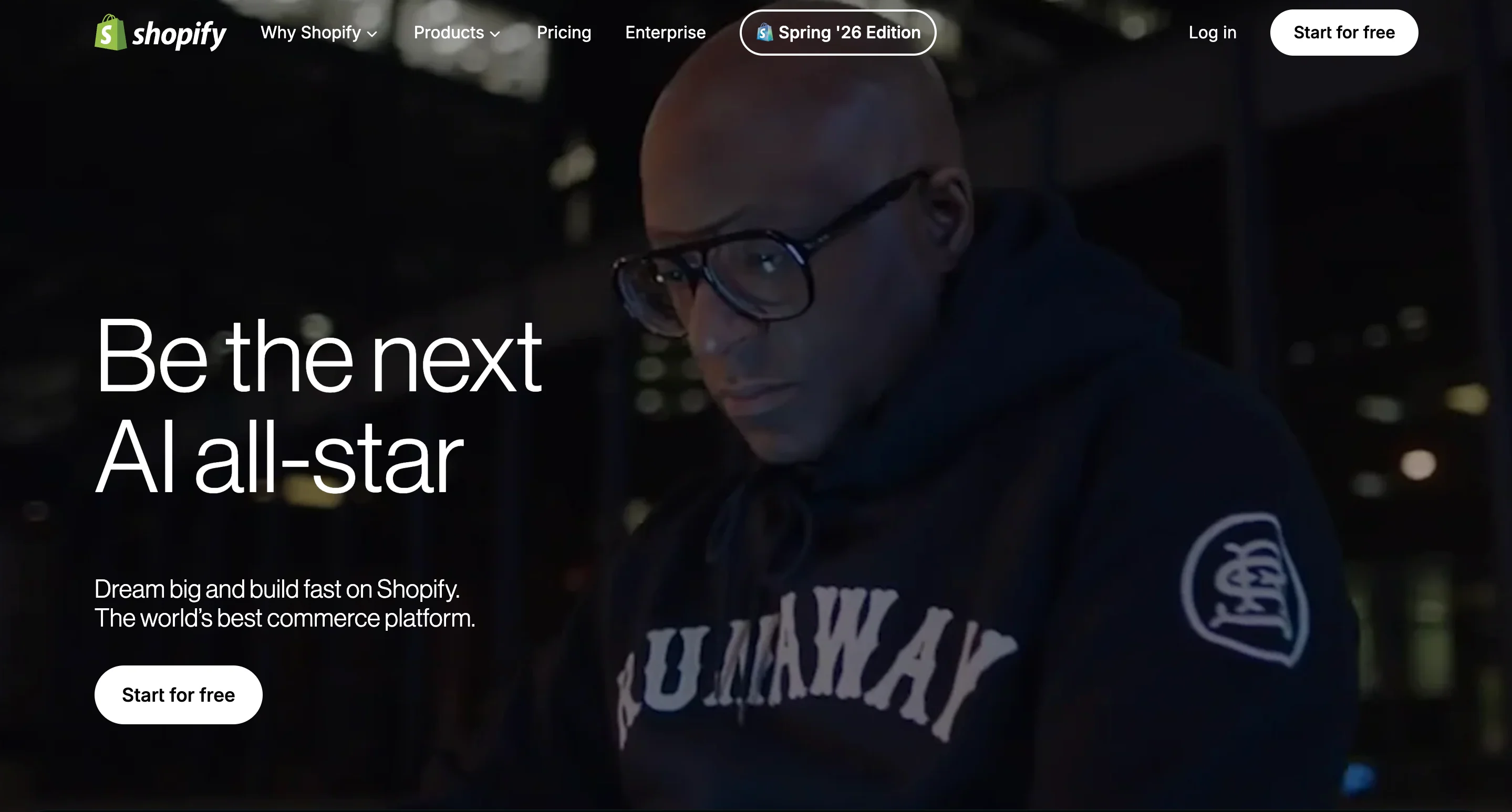 homepage of shopify website showing a man with glasses