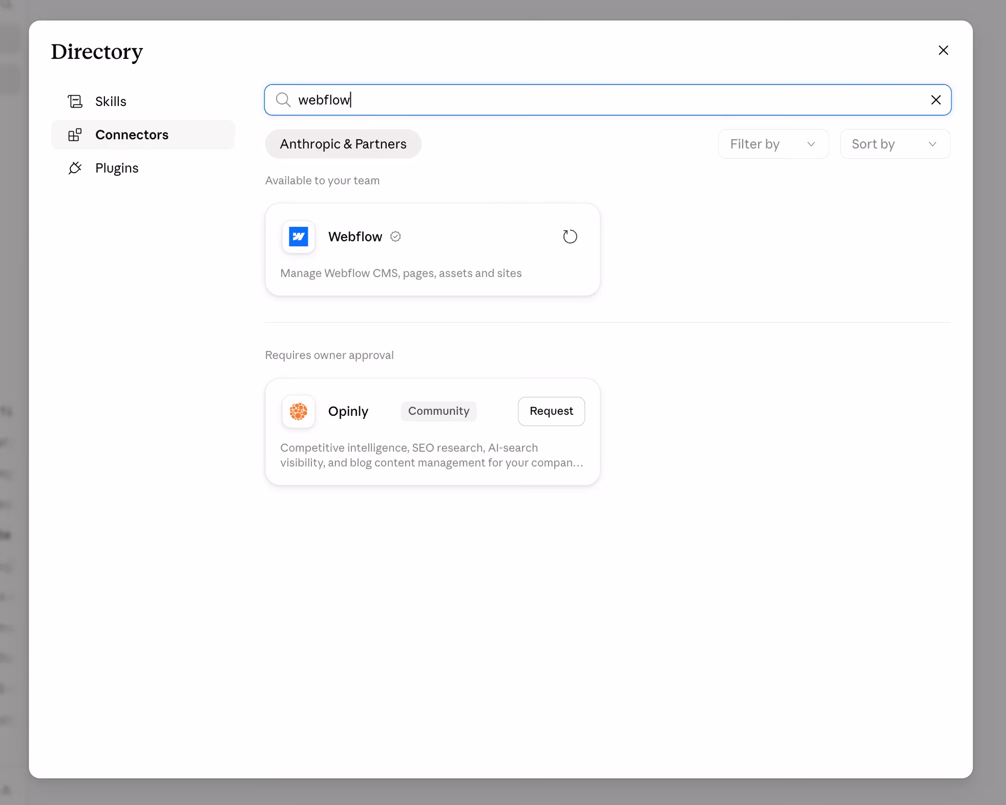 Screenshot of Claude's connector directory search results for 'webflow,' showing the official Webflow connector available to the team and a community-built Opinly connector requiring owner approval.