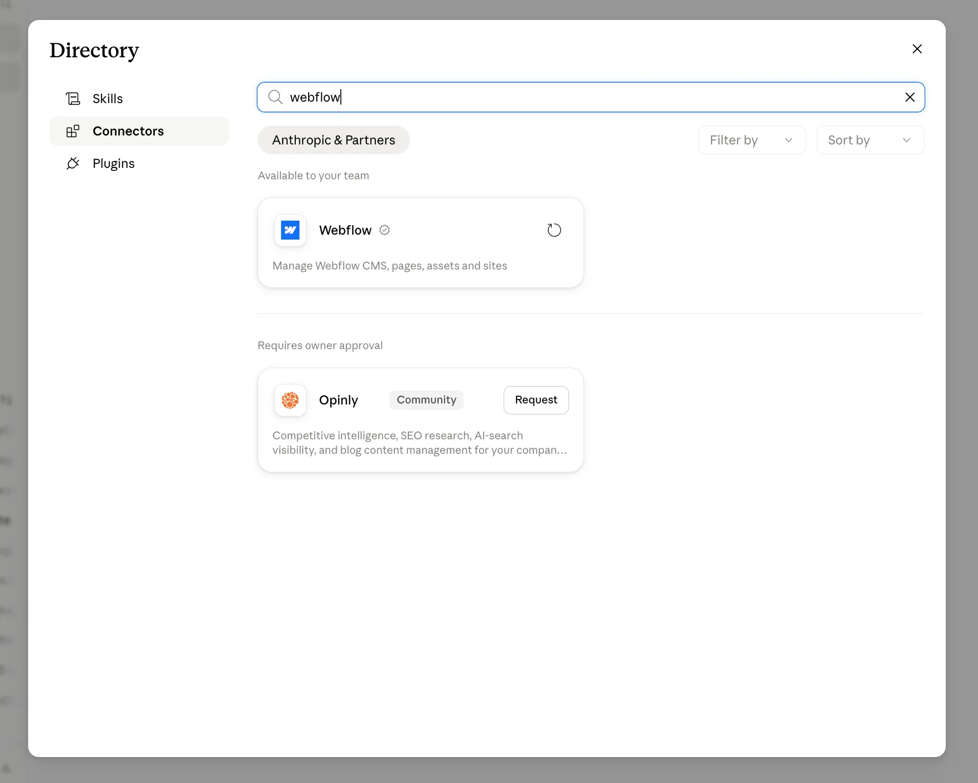 Screenshot of Claude's connector directory search results for 'webflow,' showing the official Webflow connector available to the team and a community-built Opinly connector requiring owner approval.