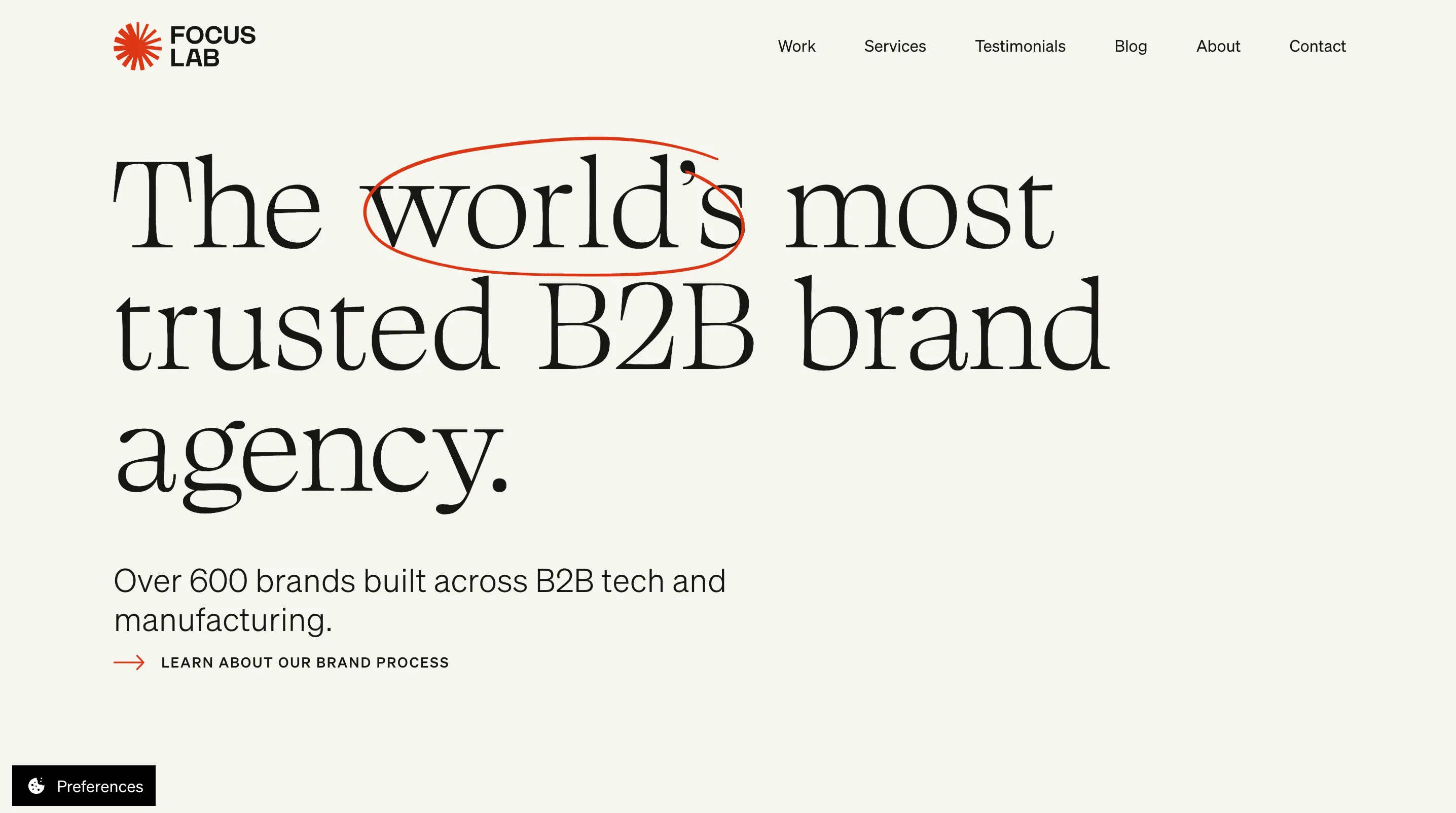 Focus Lab's homepage with the large headline "The world's most trusted B2B brand agency," the word "world's" circled in red marker style, and a subheading noting over 600 brands built across B2B tech and manufacturing.