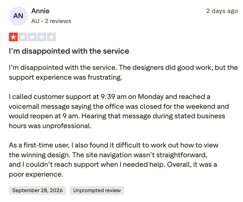 Trustpilot review by Annie, 1 out of 5 stars, dated September 28, 2026 (unprompted review). The reviewer says she's disappointed with 99designs' service, citing frustrating customer support (calling during stated business hours and reaching a voicemail saying the office was closed) and difficulty navigating the site to view her winning design.