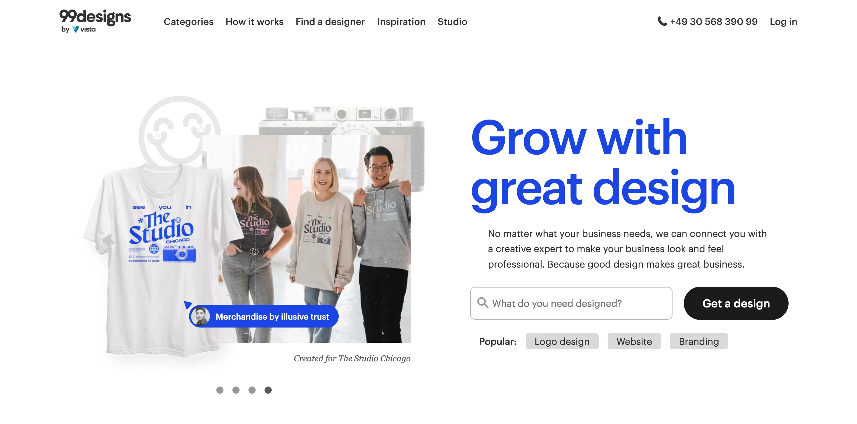Screenshot of the 99designs homepage hero section, showing the headline "Grow with great design," a search bar prompting "What do you need designed?" with a "Get a design" button, popular category tags for logo design, website, and branding, and a product photo of a custom t-shirt made for "The Studio Chicago."