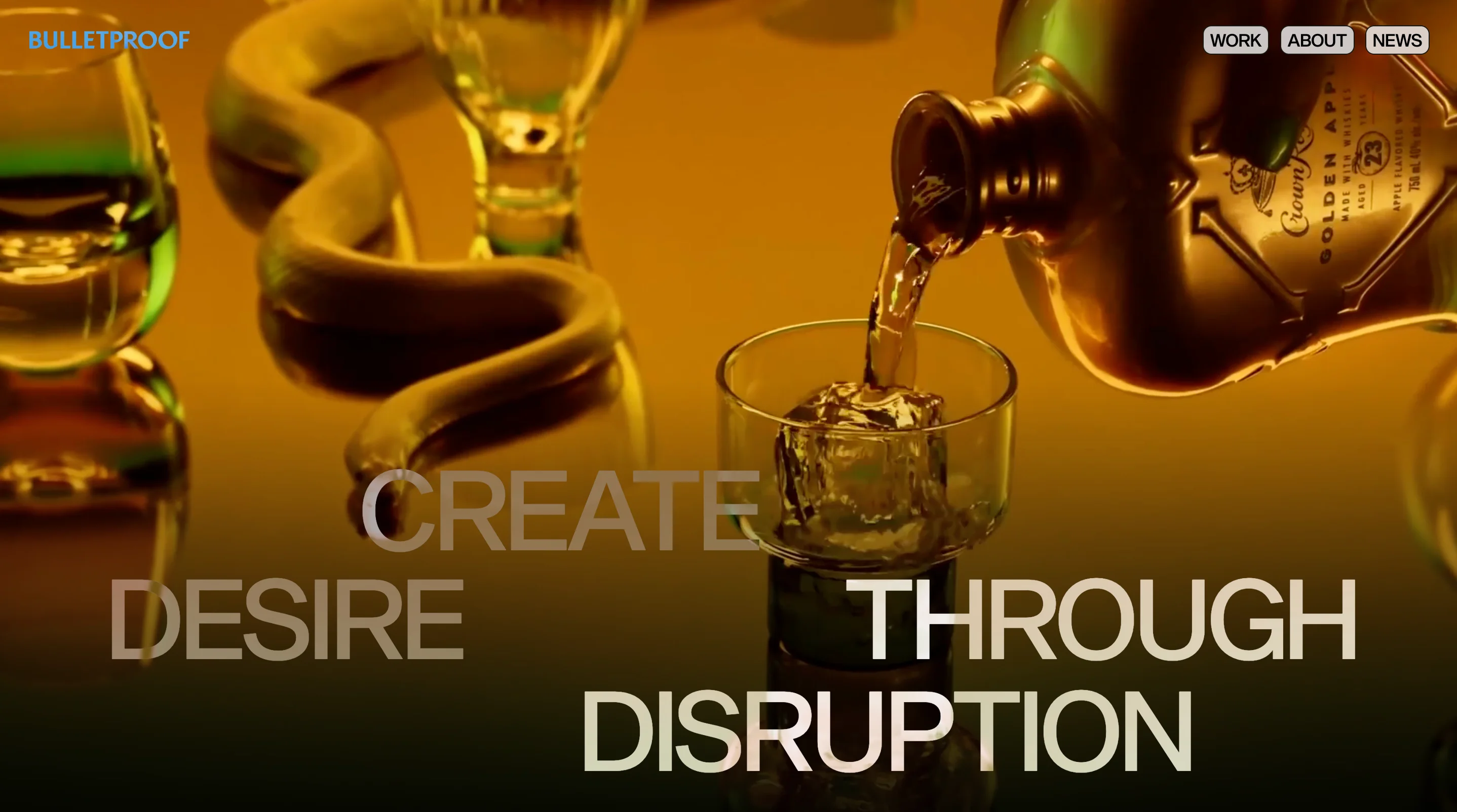Bulletproof homepage with the headline Create Desire Through Disruption over whisky being poured into a glass