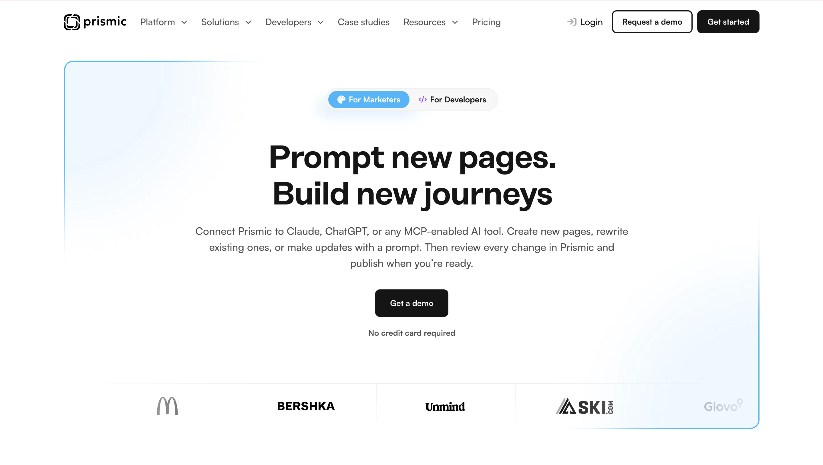 Prismic homepage headline “Prompt new pages. Build new journeys” with a For Marketers and For Developers toggle