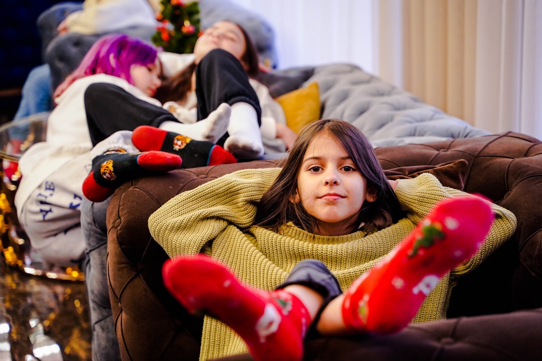 A cozy family relaxing in a warm living room during winter - heating &amp; furnace services