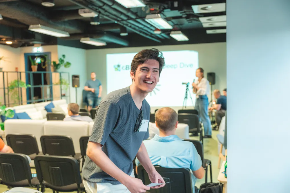 A smiling guest in the hall at eBPF & observability TechSpot