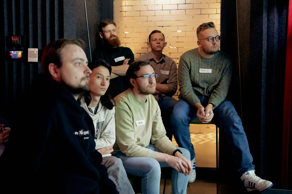 Guests seated in a small lounge listening to a talk at Inside game architecture